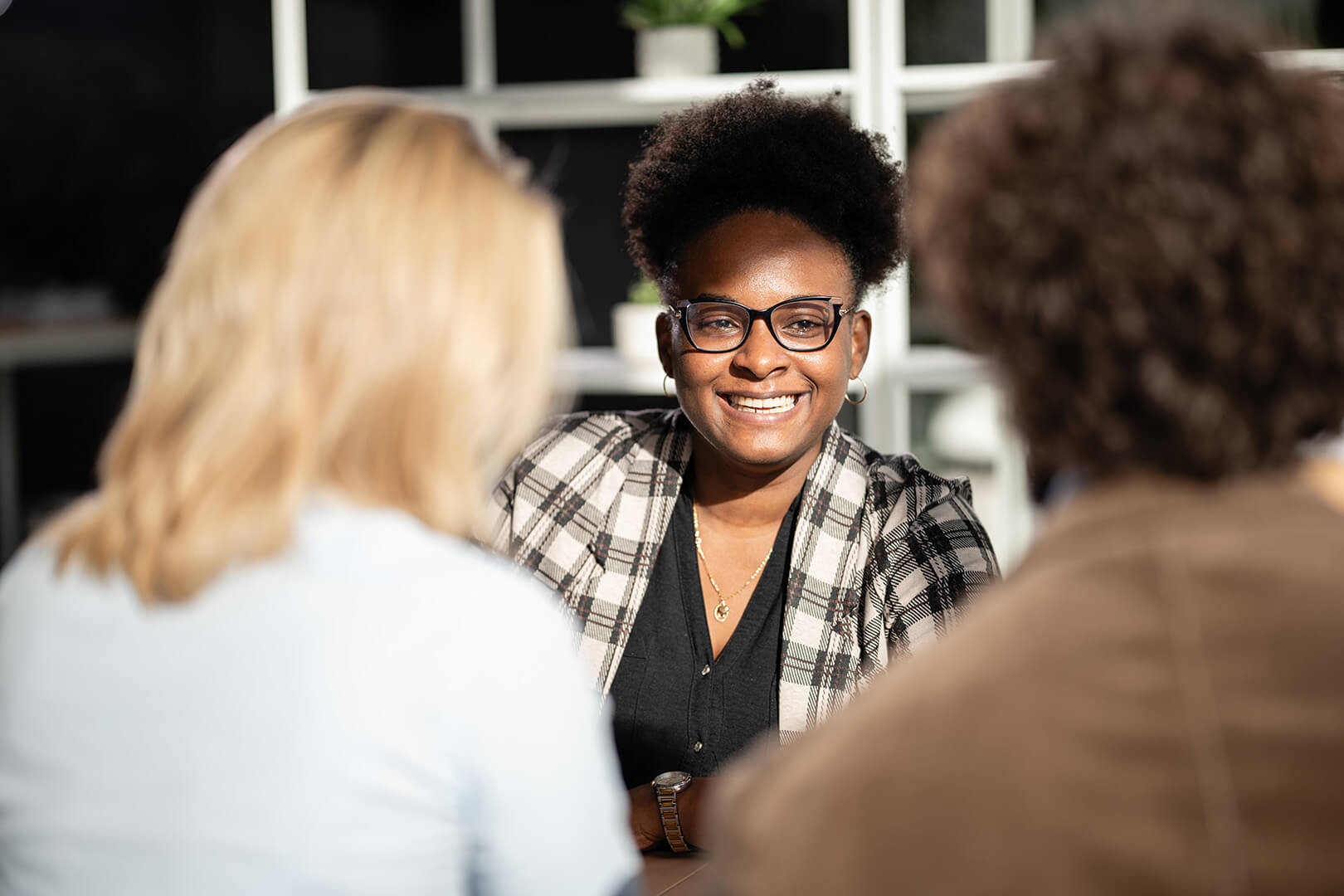 Diverse women colleagues collaborating in a business meeting